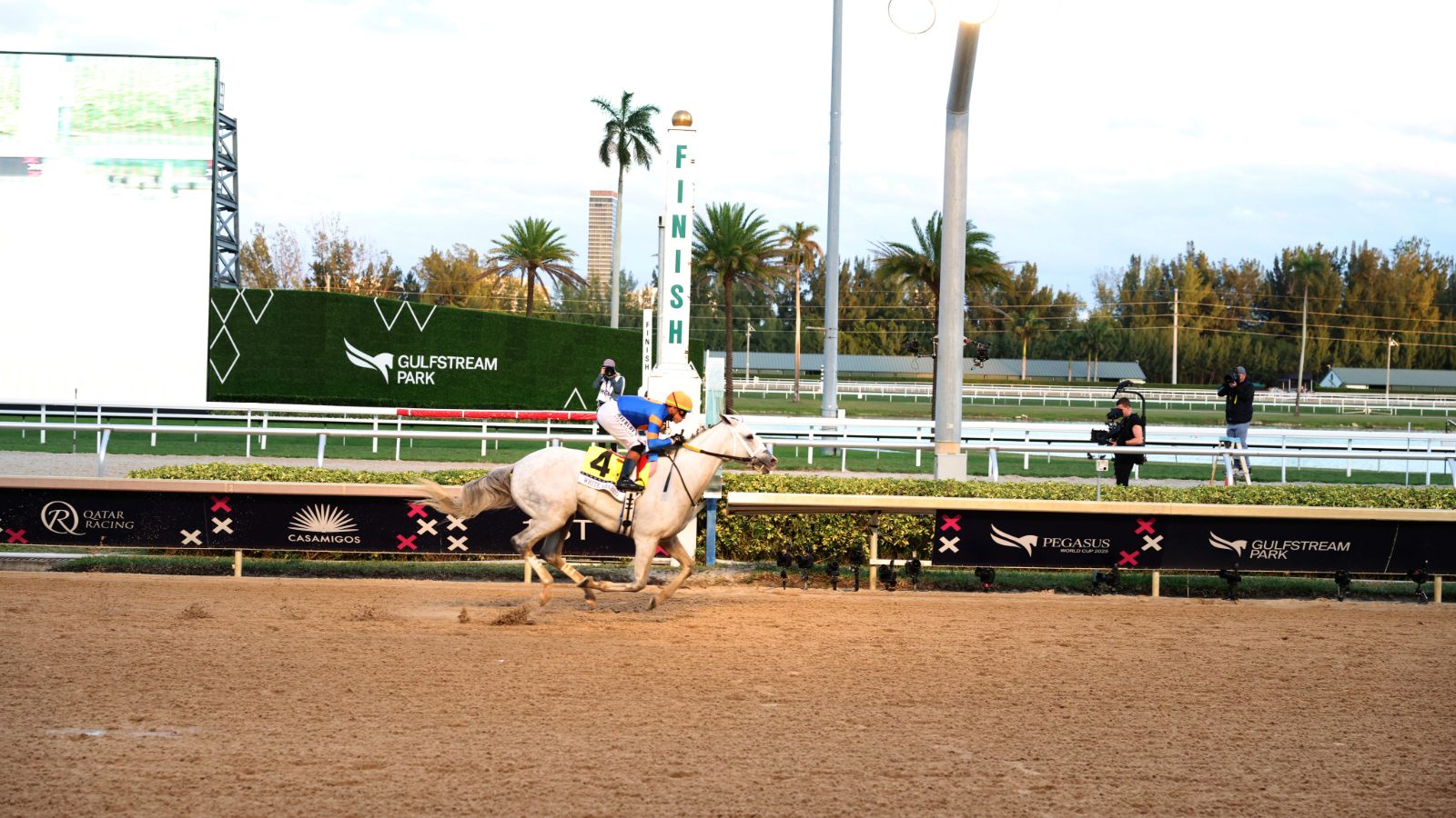 White Abarrio crosses the finish line and wins the race during Pegasus World Cup 2025 at Gulfstream Park
