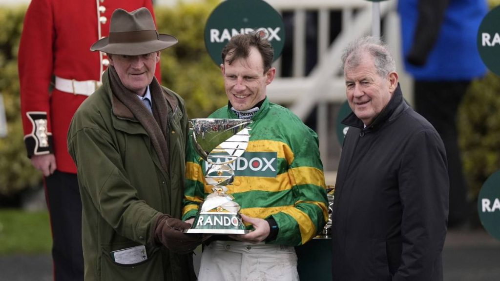 Winning trainer Willie Mullins (left) and jockey Paul Townend celebrate with the trophy alongside owner JP McManus