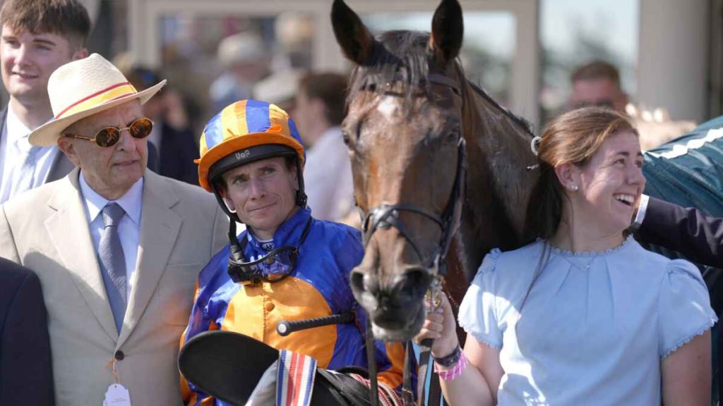 Ryan Moore looks admiringly at Diamond Necklace